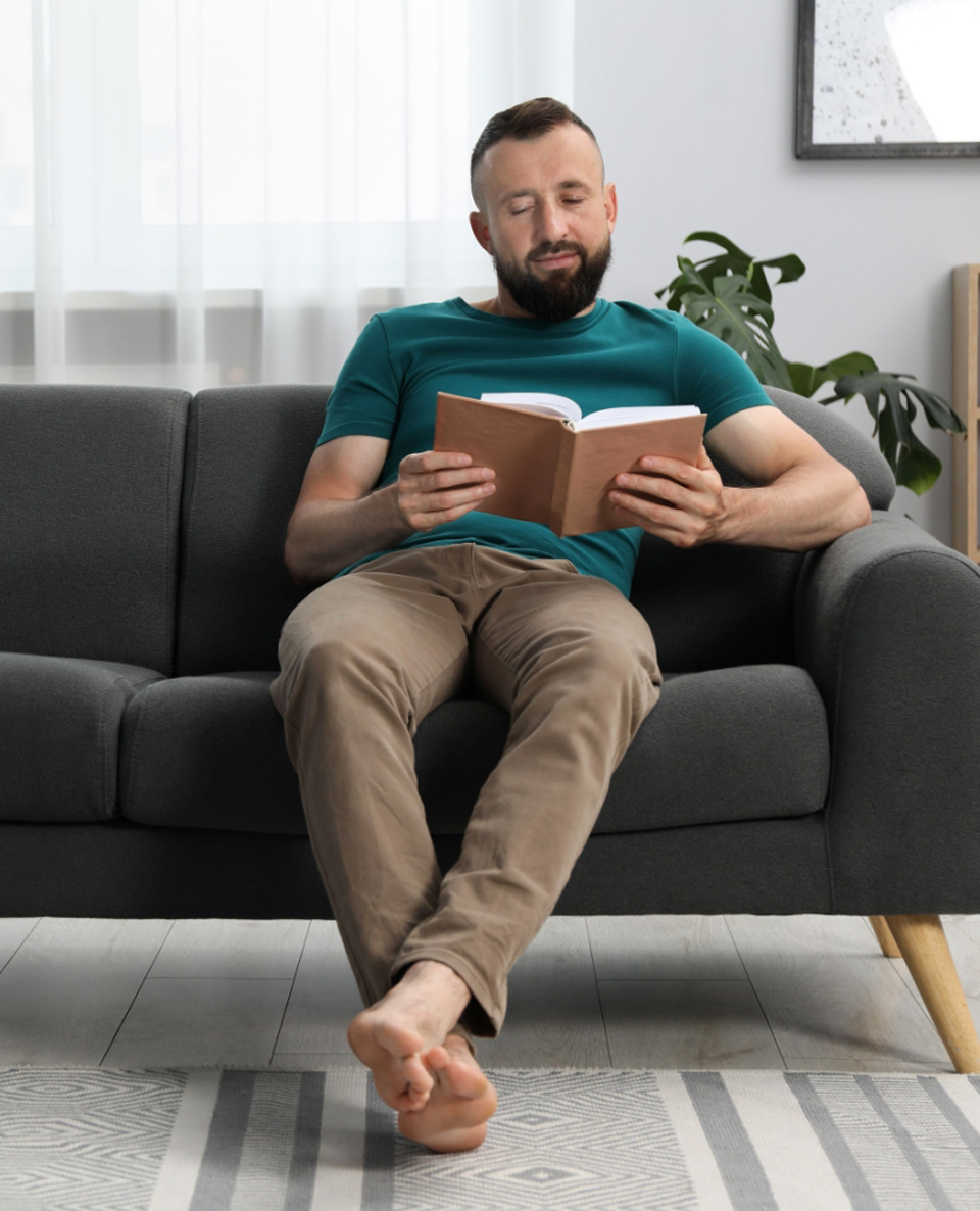 Man lounging on sofa